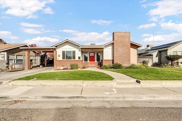 view of front facade featuring a front lawn and a carport