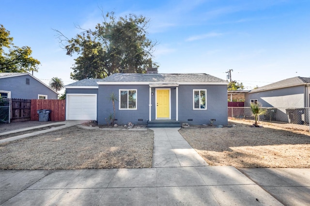 ranch-style home featuring a garage