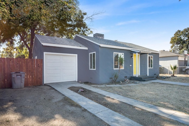 single story home with a garage