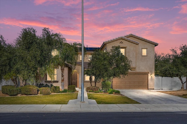 view of front facade featuring a yard and a garage