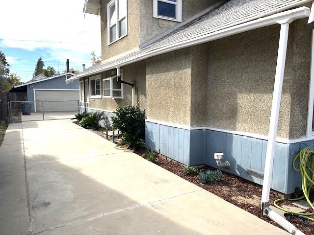 view of side of property with an outbuilding and a garage