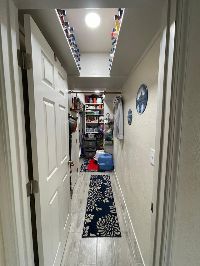 hall with light hardwood / wood-style floors