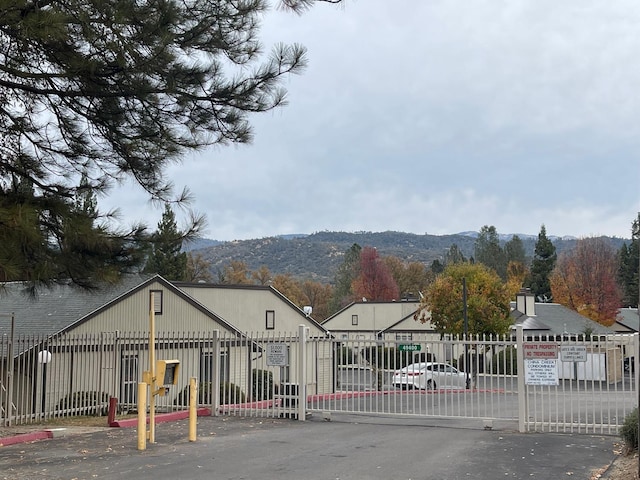 view of gate with a mountain view