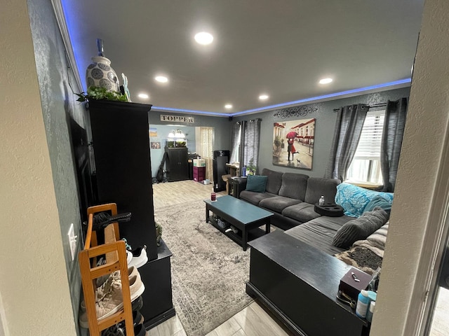 home theater featuring light hardwood / wood-style flooring and crown molding