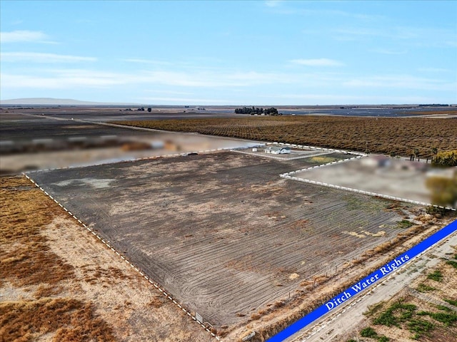 birds eye view of property featuring a rural view