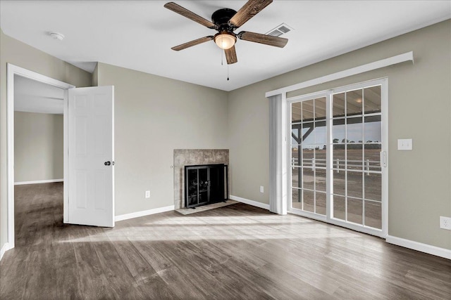 unfurnished living room with ceiling fan and hardwood / wood-style flooring