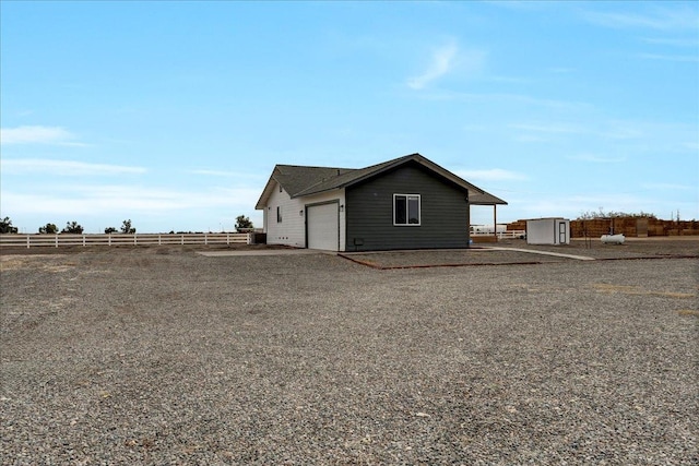 view of side of property featuring an outbuilding