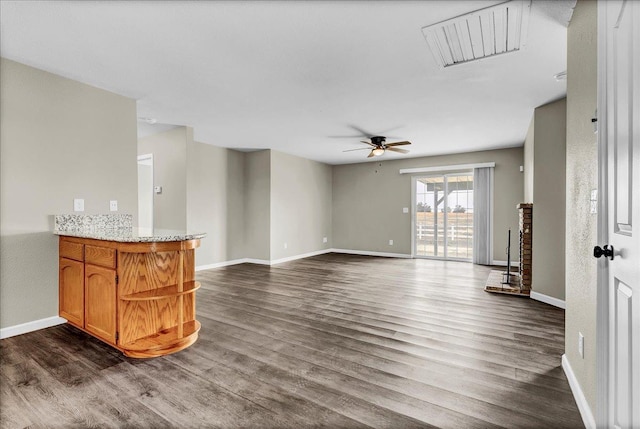 living room with dark hardwood / wood-style flooring and ceiling fan