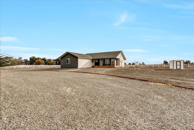 view of front of house featuring a rural view