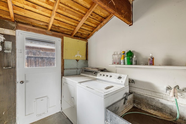 washroom featuring separate washer and dryer and sink