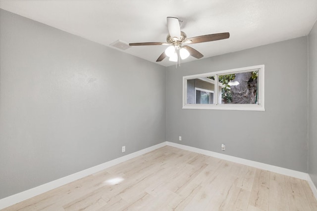 empty room with light hardwood / wood-style flooring and ceiling fan