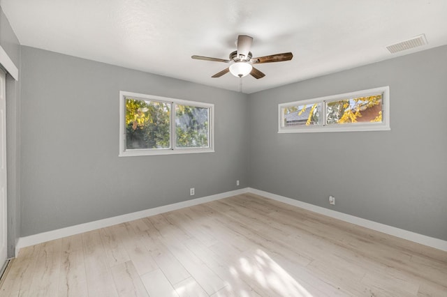 unfurnished room with light hardwood / wood-style floors and ceiling fan