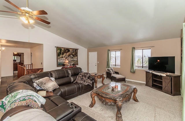 living area with lofted ceiling, carpet flooring, a ceiling fan, and baseboards