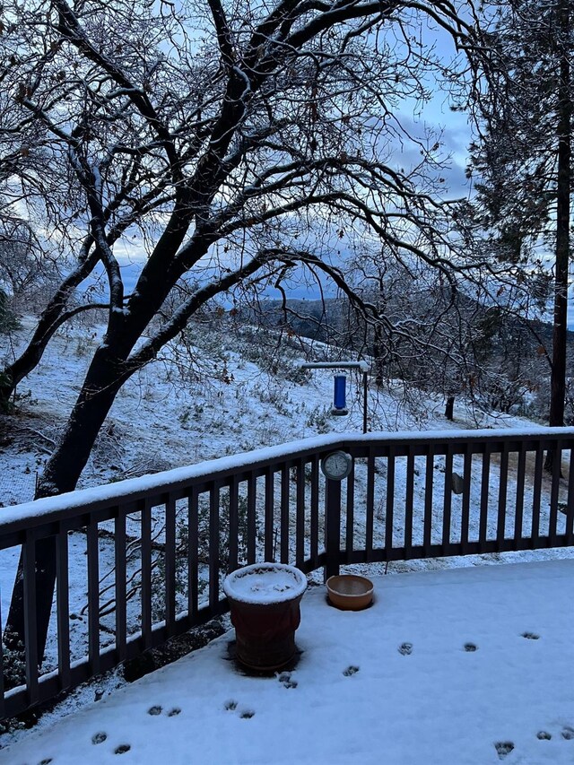 view of snow covered deck