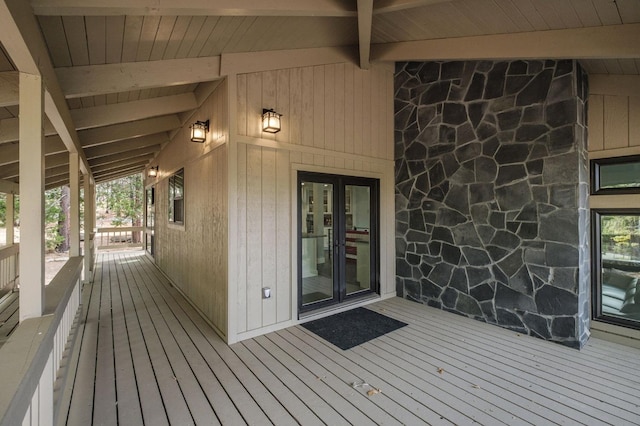 wooden deck with french doors and a porch