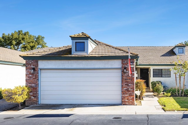 view of front of property with a garage