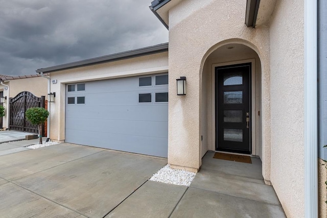 doorway to property featuring a garage