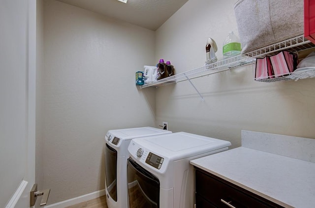 washroom featuring washing machine and clothes dryer