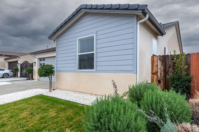 view of property exterior featuring a yard