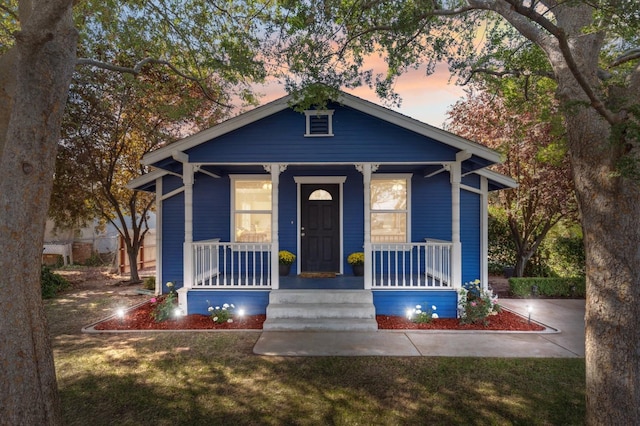 bungalow-style home with a porch