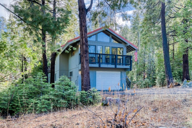 back of house featuring a garage