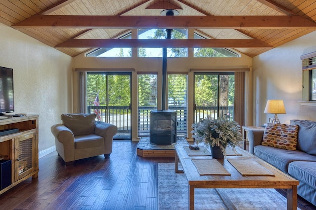 living room featuring vaulted ceiling with beams, dark hardwood / wood-style flooring, a wood stove, and wood ceiling