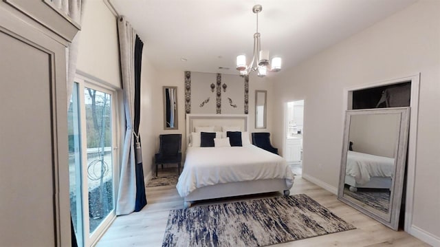 bedroom with a chandelier, access to exterior, and light hardwood / wood-style flooring