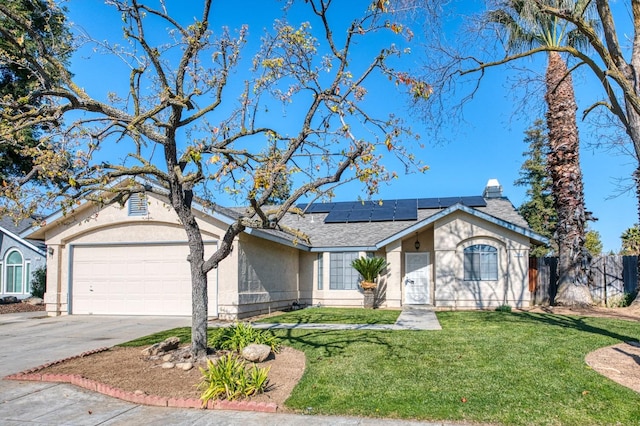 ranch-style house with a garage, a front lawn, and solar panels