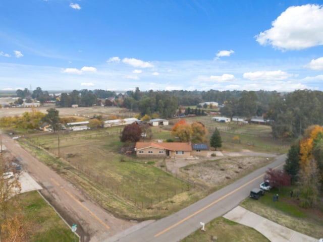 birds eye view of property with a rural view