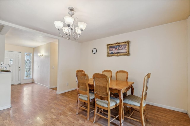 12713 Rd 37 Unit 1/2, Madera, CA 93636 - dining room with baseboards, a chandelier, and light wood finished floors