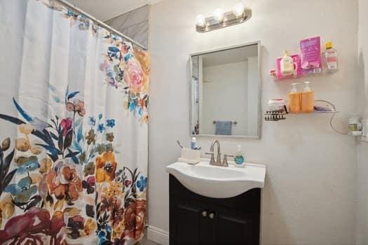 bathroom featuring vanity and walk in shower