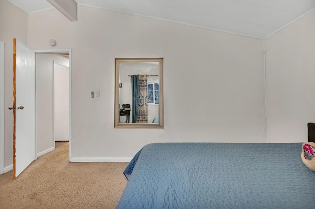 carpeted bedroom with vaulted ceiling