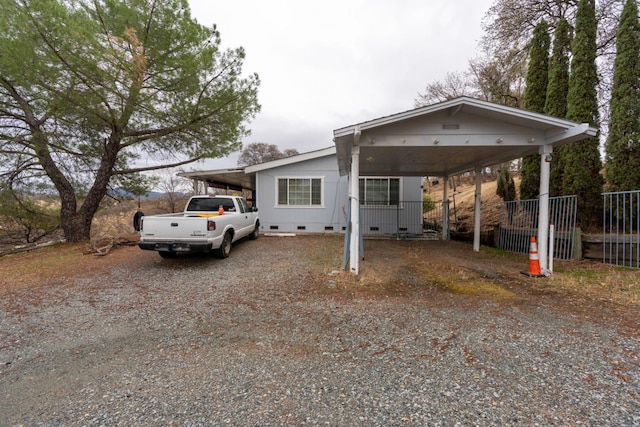 manufactured / mobile home featuring a carport