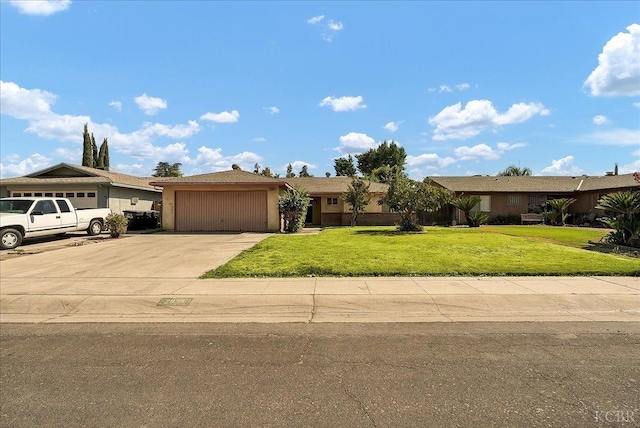 ranch-style house with a front yard and a garage