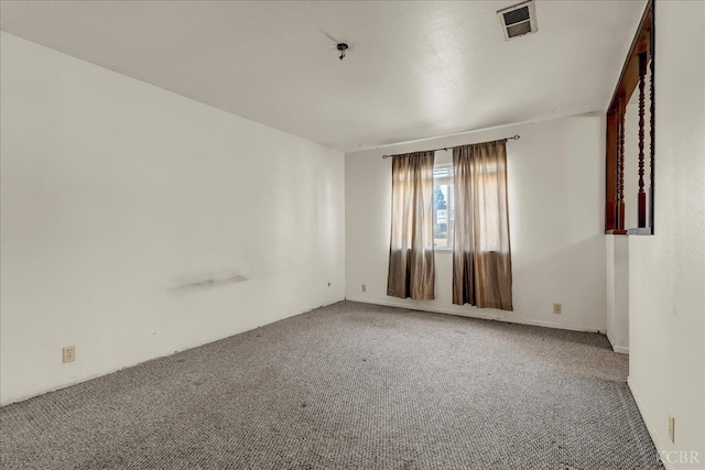 unfurnished room featuring carpet flooring