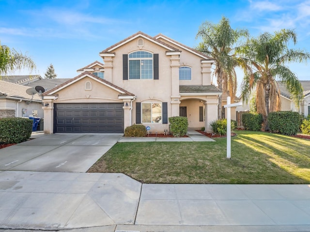 view of front of home with a garage and a front yard