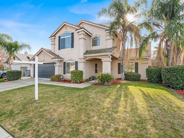 view of front of property featuring a front yard and a garage