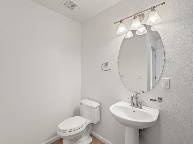 bathroom with sink and toilet