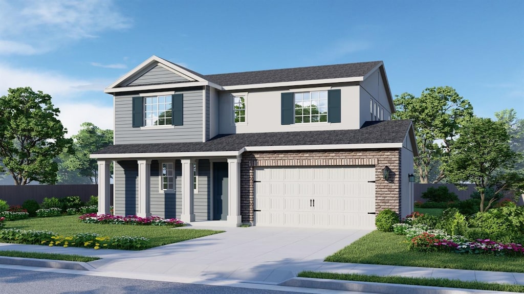 view of front facade with a garage and a front lawn