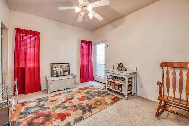 living area featuring ceiling fan