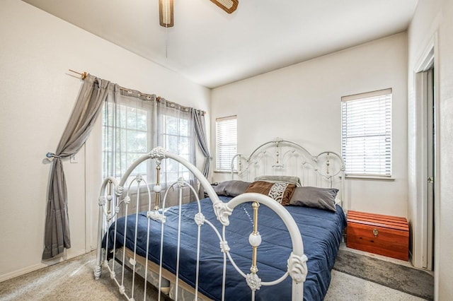 bedroom with multiple windows and ceiling fan