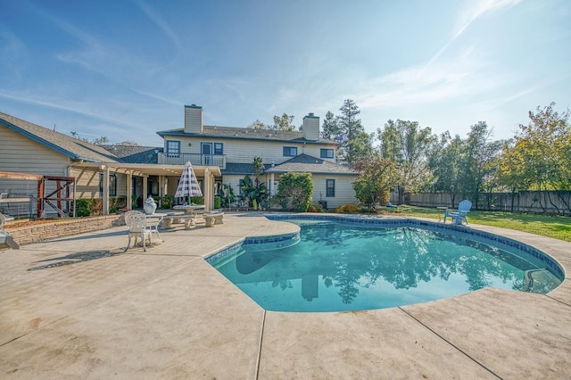 view of swimming pool with a patio