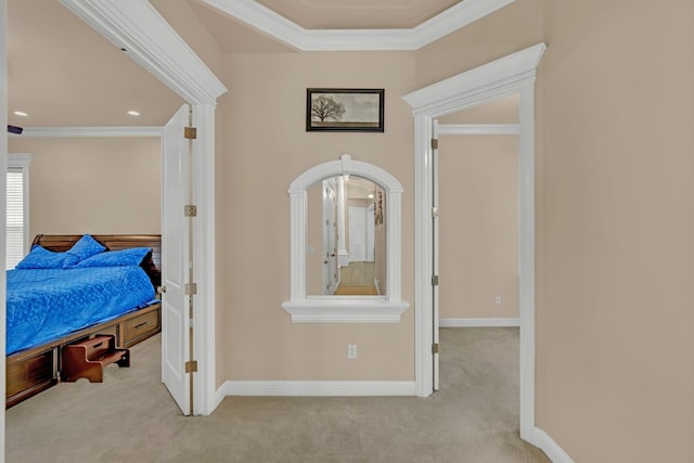 corridor featuring light colored carpet and ornamental molding