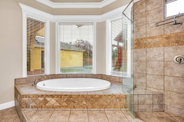 bathroom featuring a healthy amount of sunlight, tile patterned floors, separate shower and tub, and ornamental molding