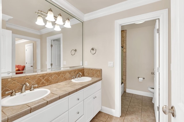 bathroom featuring vanity, tasteful backsplash, tile patterned floors, and ornamental molding