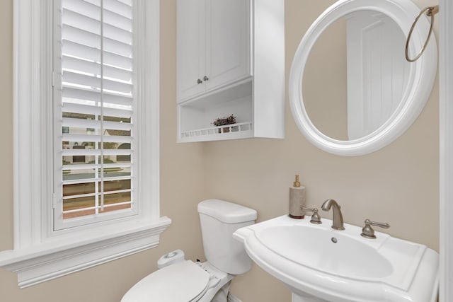 bathroom with toilet and sink