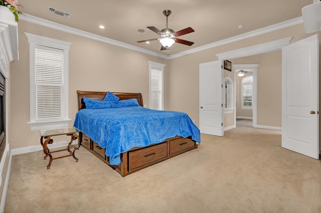 bedroom with ceiling fan, light carpet, and ornamental molding