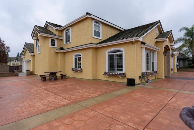 back of house featuring a patio area