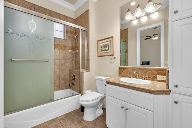 full bathroom featuring ceiling fan, tile patterned flooring, enclosed tub / shower combo, crown molding, and toilet