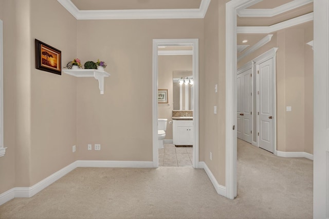 hall with crown molding and light colored carpet